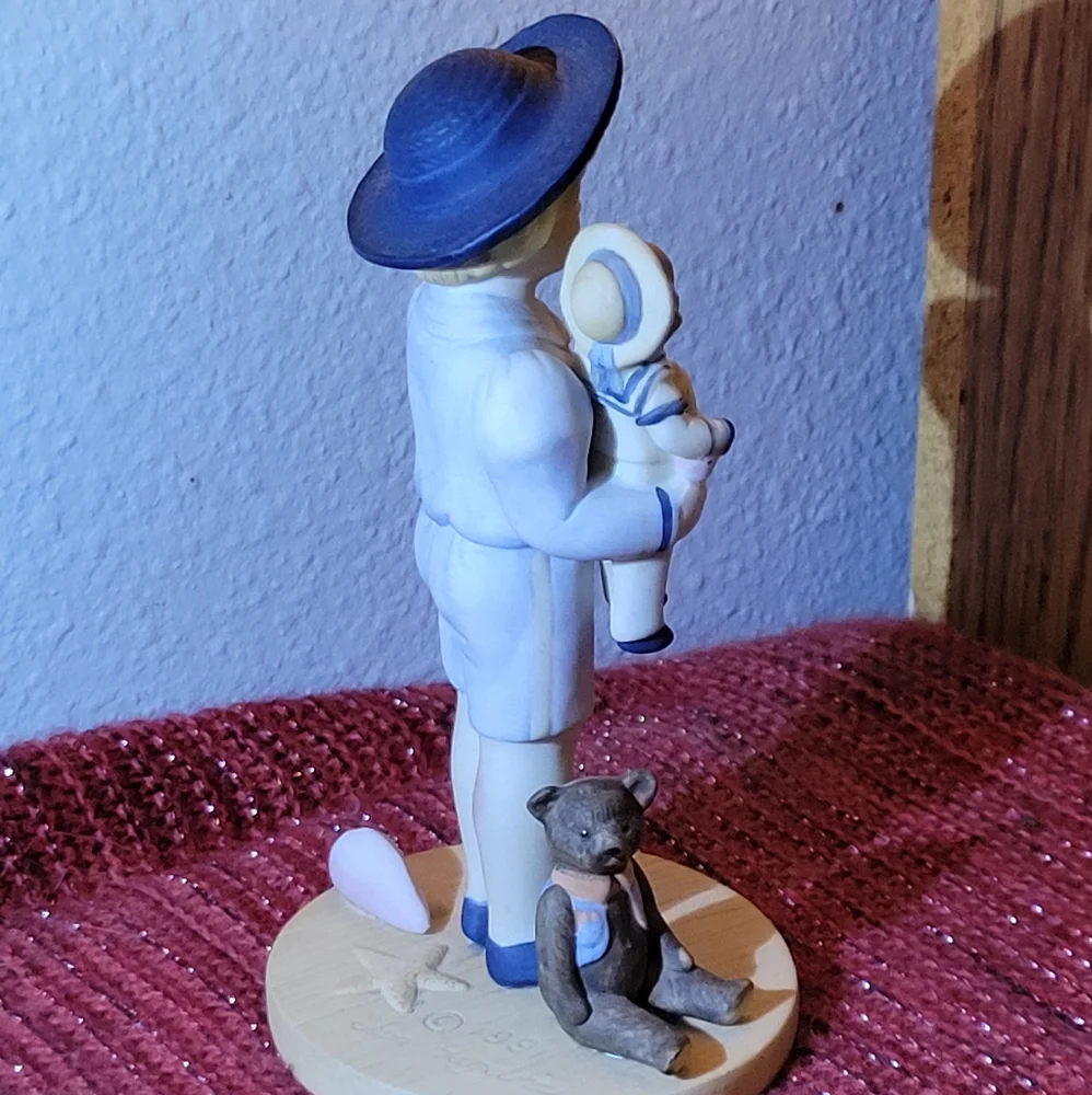 VINTAGE PORCELAIN BOY WITH DOLL FIGURINE 